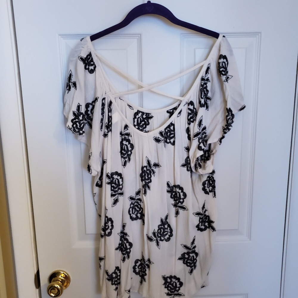White a black floral blouse